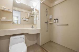 a bathroom with a toilet and a sink and a shower at JinJiang Inn Datong Pingchengqiao in Datong +151 photos