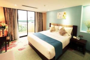 Postel nebo postele na pokoji v ubytování Gui Feng Hotel + 123 fotografií