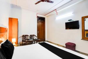 Televisor o centre d'entreteniment de Super Hotel O Paharganj Near Railway Station Formerly Chand Palace