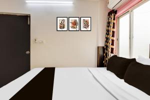 Super Hotel O Guntur客房内的一张或多张床位