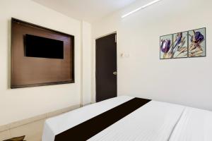 Super Hotel O Guntur客房内的一张或多张床位