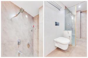 a bathroom with a toilet and a shower at Super Townhouse Dwarka Nagar Near Ramatalkies in Visakhapatnam