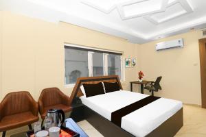 Super Collection O Ranchi Station Near Rajendra Chowk Formerly Bodhraj Paradise客房内的一张或多张床位