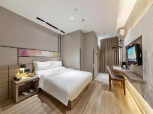 Ένα ή περισσότερα κρεβάτια σε δωμάτιο στο Starway Hotel (xiamen zhongshan road) +76 φωτογραφίες