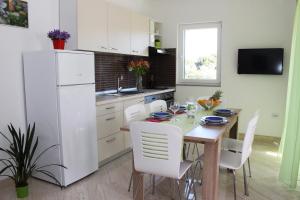 Kuchyň nebo kuchyňský kout v ubytování Smart Apartments