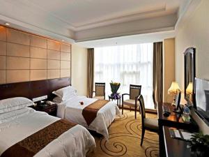 Katil atau katil-katil dalam bilik di Vienna Hotel Xian Railway North Station Branch +246 gambar