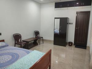 Postel nebo postele na pokoji v ubytování Mansons Homestay