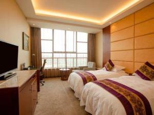 TV a/nebo společenská místnost v ubytování GreenTree Eastern Quzhou Hewu Road Hotel