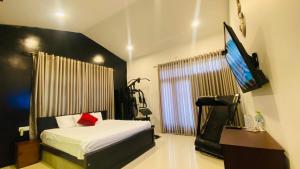 TV a/nebo společenská místnost v ubytování Hawana Home Stay