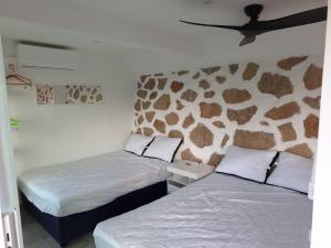 A bed or beds in a room at Casa Breizh