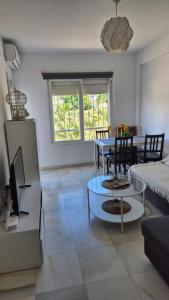 a living room with a couch and a table at CANDESUN APARTMENT*** in Cala del Moral