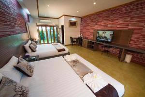 TV a/nebo společenská místnost v ubytování 111 Resort and Spa