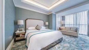 Ένα ή περισσότερα κρεβάτια σε δωμάτιο στο Xian Jue Vu Hotel +267 φωτογραφίες