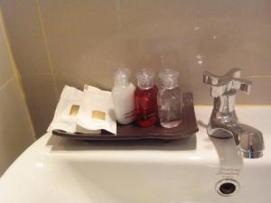 a tray sitting on top of a bathroom sink at Haak Boutique Hotel in Chiang Mai +34 photos