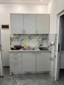 Kuchyň nebo kuchyňský kout v ubytování Apartmani Filip