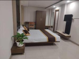 Voodi või voodid majutusasutuse Mysore Happy Vibes 3bhk flat toas