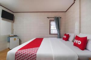 Postel nebo postele na pokoji v ubytování OYO 1018 Pikul Yoo Suk Resort + 31 fotografií