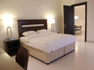 Ένα ή περισσότερα κρεβάτια σε δωμάτιο στο Unique Suites