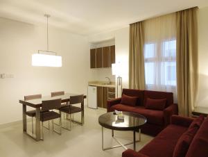 a living room with a couch and a table at Unique Suites in Riyadh
