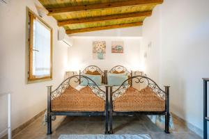 Ένα ή περισσότερα κρεβάτια σε δωμάτιο στο Monolocale Melograno