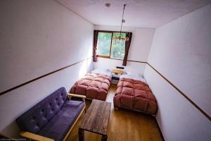 Ένα ή περισσότερα κρεβάτια σε δωμάτιο στο Lodge Raven