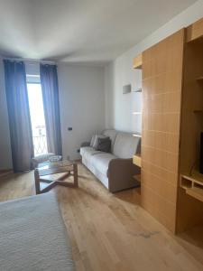 a living room with a couch and a table at garibaldi citta' in Trapani