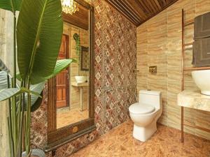 a bathroom with a toilet and a sink at OYO 90636 Teratak Zakiah Chalet in Jerantut +54 photos