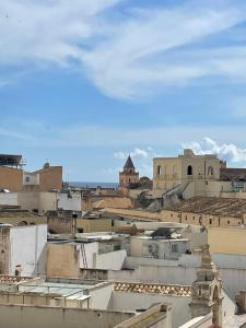 a view of roofs of buildings in a city at garibaldi citta' in Trapani +11 photos