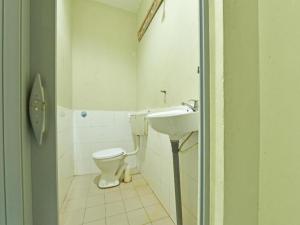 a bathroom with a toilet and a sink at OYO 90708 D'kuala Waterfront Chalet & Boat Charters in Kampong Aman