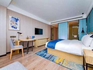 Ένα ή περισσότερα κρεβάτια σε δωμάτιο στο Echarm Hotel Xiantao Yuantai Weilaicheng +201 φωτογραφίες