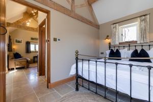 a bedroom with a bed in a room at Country Cottage with Hot Tub - pre-heated for your arrival in Buxton