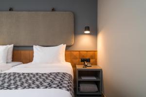 Postel nebo postele na pokoji v ubytování Amante Narikala Boutique Hotel