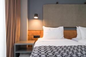 Postel nebo postele na pokoji v ubytování Amante Narikala Boutique Hotel
