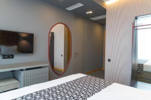 Postel nebo postele na pokoji v ubytování Amante Narikala Boutique Hotel