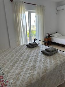 Postel nebo postele na pokoji v ubytování ELÉA Guesthouse himare