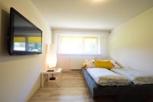 Posteľ alebo postele v izbe v ubytovaní Apartament Na Górskiej