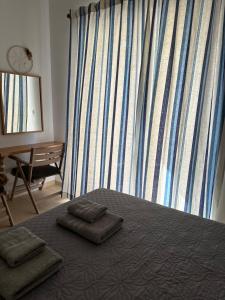 Postel nebo postele na pokoji v ubytování ELÉA Guesthouse himare