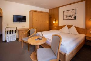 Posteľ alebo postele v izbe v ubytovaní Hotel Garni Subretta
