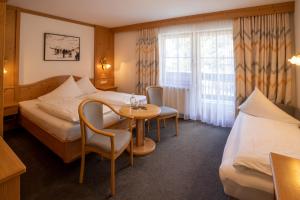 Posteľ alebo postele v izbe v ubytovaní Hotel Garni Subretta