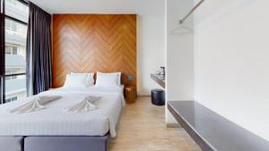 Giường trong phòng chung tại INBED