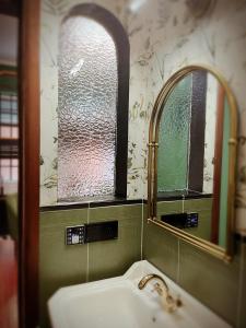 a bathroom with a sink and a mirror at Fan Hua Flower in Shanghai