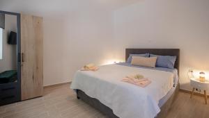 Postel nebo postele na pokoji v ubytování Artemis House Corfu Town