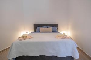 Postel nebo postele na pokoji v ubytování Artemis House Corfu Town