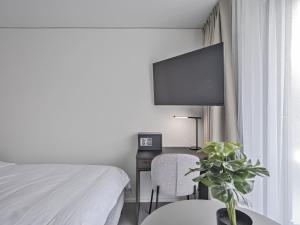 Sjónvarps- og/eða afþreyingartæki á MOOI Apartments Grenchen