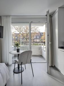 TV a/nebo společenská místnost v ubytování MOOI Apartments Grenchen