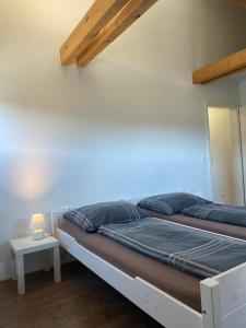 Posteľ alebo postele v izbe v ubytovaní Haus Kampl - Appartement Grundlsee