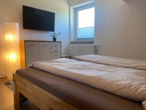 Posteľ alebo postele v izbe v ubytovaní Haus Kampl - Appartement Grundlsee