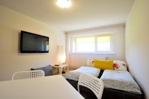 Posteľ alebo postele v izbe v ubytovaní Apartament Na Górskiej