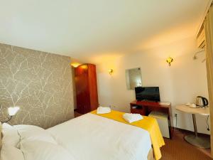 Postel nebo postele na pokoji v ubytování Central Hotel & Restaurant