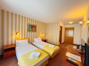 Postel nebo postele na pokoji v ubytování Central Hotel & Restaurant